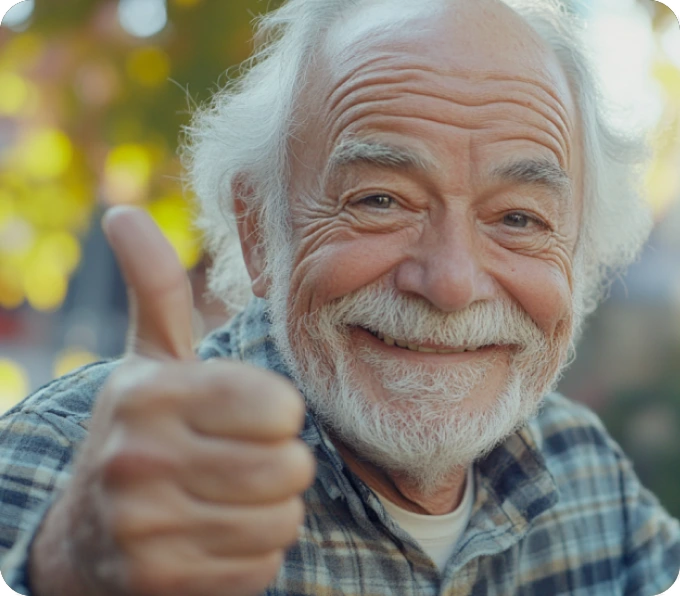 Elderly man with white beard giving thumbs up showing confidence satisfaction with KISA fall detection service