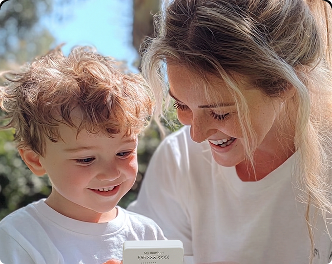 Mother and son using a KISA Phone together
