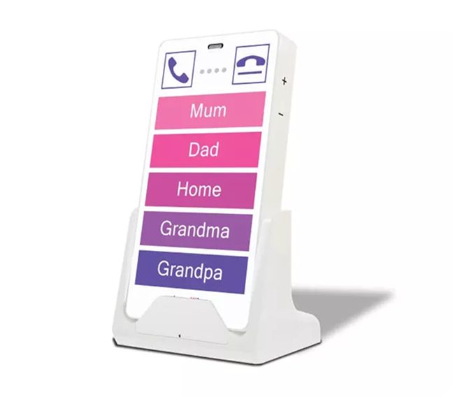 KISA Phone on a cradle displaying large, easy-to-press buttons labeled 'Mum,' 'Dad,' 'Home,' 'Grandma,' and 'Grandpa' in bright shades of purple and pink, designed for simple and accessible communication.