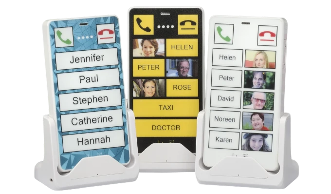 Three KISA Phones on display, each programmed with large, easy-to-read contacts for Jennifer, Paul, Stephen, Helen, and others, along with services like Taxi and Doctor